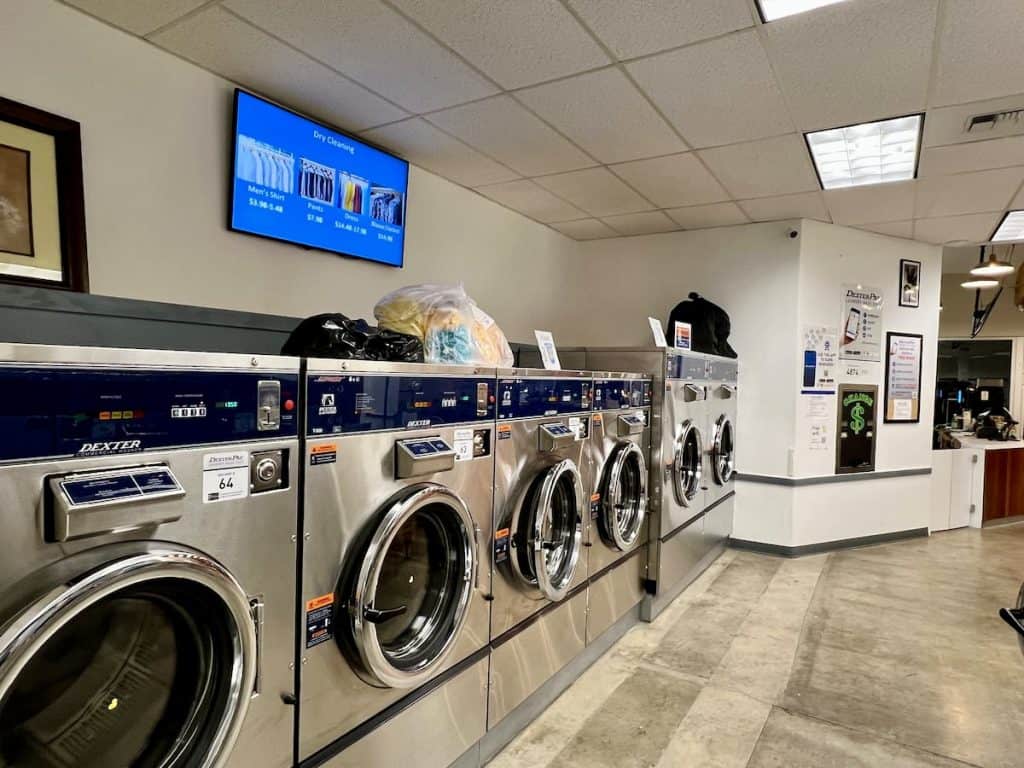 Commercial laundromat washers in a full row