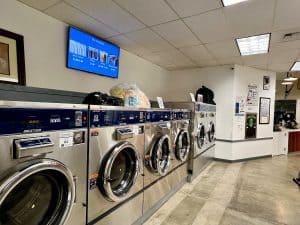 Commercial laundromat washers in a full row