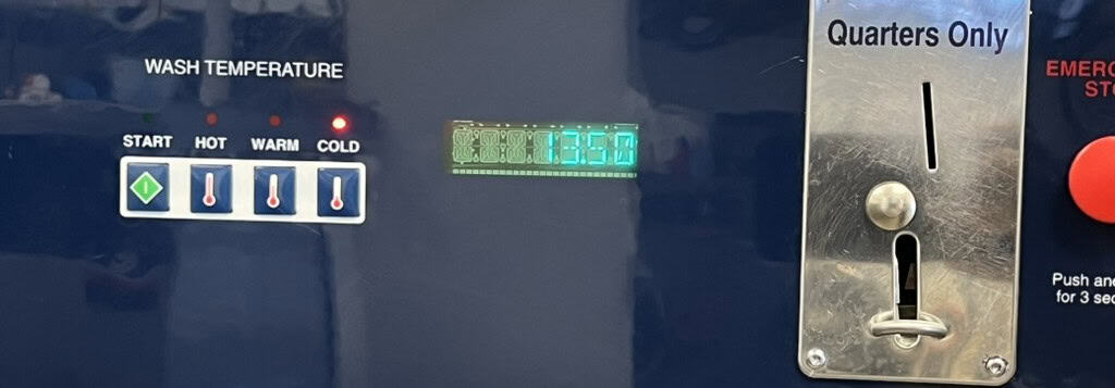 Laundromat washer control panel with coin slot and temperature settings